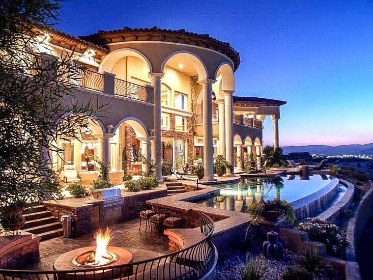 Resort pool and fire, lit for the evening — EverClear Pools, the Las Vegas Valley